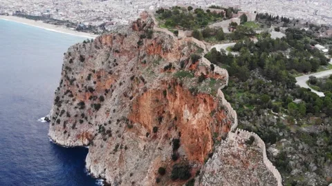 Aerial View Of A High Steep Cliff Above The Sea With A Medieval Fortress On Top Stock Footage 195103856