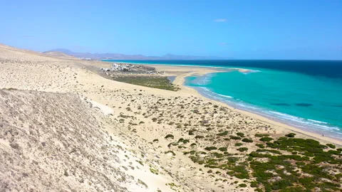 Aerial view of high tide, along the coast of Sotavento Beach. Stock Footage 284286947