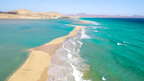 Aerial view of high tide, along the coast of Sotavento Beach. Stock Footage 284296947