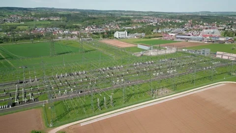 Aerial view of high voltage electric power station with pylons and cables Stock Footage 303223553