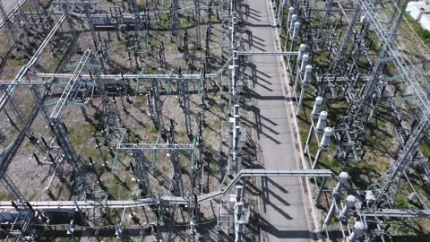 Aerial view of a high voltage electrical substation. Stock Footage
