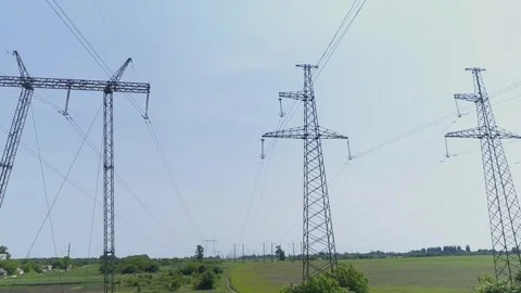Aerial view. High-voltage electrical pylons  in the field 스톡 동영상 317913384
