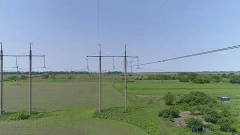 Aerial view. High-voltage electrical pylons  in the field 스톡 동영상 317913404