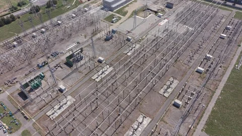 Aerial view of a high-voltage electrical substation with grid equipment Stock Footage 346013676