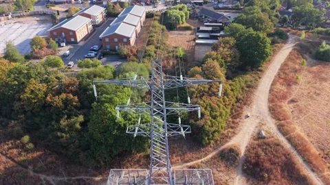 Aerial View of High Voltage Electricity Pylon and Power Lines, England Stock Footage 342295258