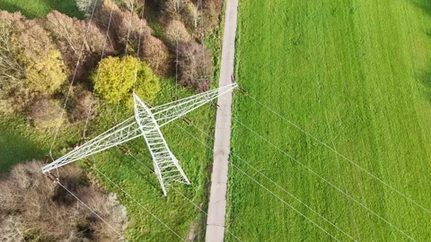 Aerial View of High Voltage Power Line Tower in Green Landscape Video stock 327973511
