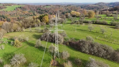 Aerial View of High Voltage Power Line Tower in Green Landscape Video stock 327974098