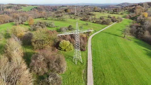 Aerial View of High Voltage Power Line Tower in Green Landscape Video stock 327974130