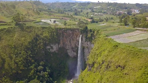 Aerial view of the highest waterfall known as Sipisopiso Waterfall in Indonesia. Stock Footage 104384954