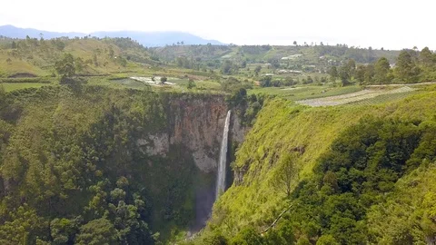 Aerial view of the highest waterfall known as Sipisopiso Waterfall in Indonesia. Stock Footage 104385695
