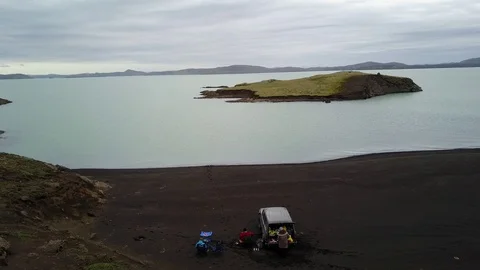 Aerial view of highlands Iceland with cloud and snow mountains in the background Stock Footage 118488593