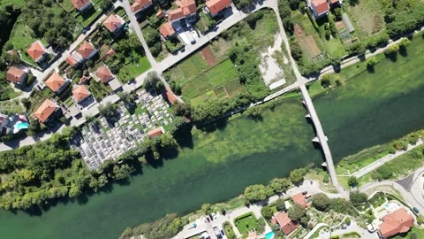 Aerial View Highlighting the River Flowing Through Picturesque Residential Area Stock Footage 290393476
