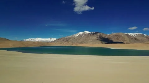 Aerial view highlighting scale, emptiness, and beauty of kiagar lake in Ladakh. 動画素材 310806833