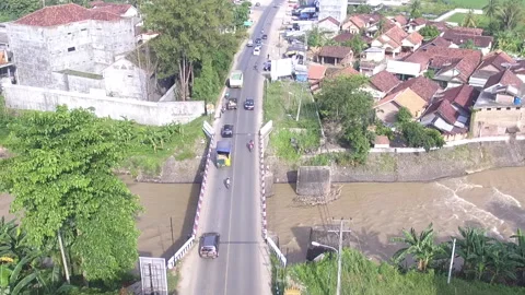 Aerial View of Highway bridge with cars passing by, rivers and rice fields Stock Footage