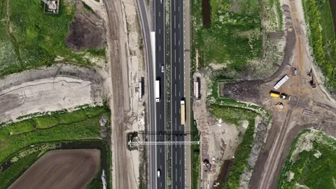 Aerial view of highway construction and traffic flow Stock Footage 335992727