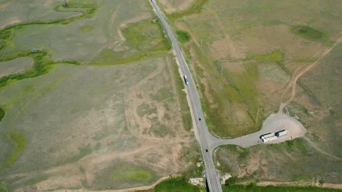 Aerial view of highway in the endless steppe landscape Stock Footage 219946539