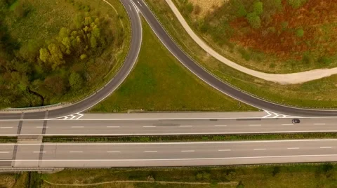 Aerial view of Highway with exit viewed from the air - Aerial view Stock Footage 62936293