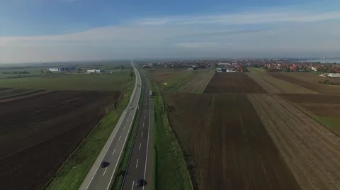 Aerial view of highway in the fields near by village. Stock Footage 59368215
