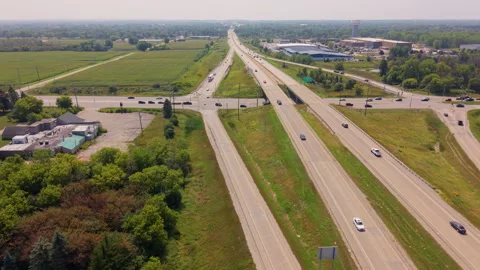 Aerial View Of Highway Freeway Interchange With Traffic And Green Fields Stock Footage 344087191