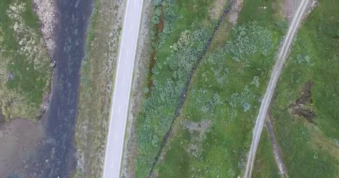Aerial view of highway go through highland pass Stock Footage 69118635