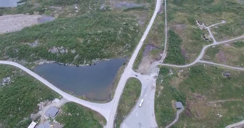 Aerial view of highway go through highland pass Stock Footage 69118768