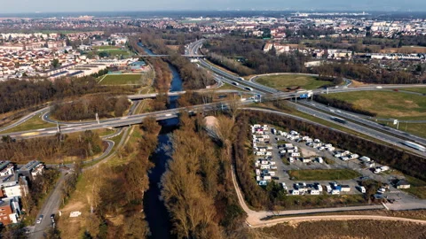 Aerial View of Highway Interchange and River in Urban Area Stock Footage 293640941