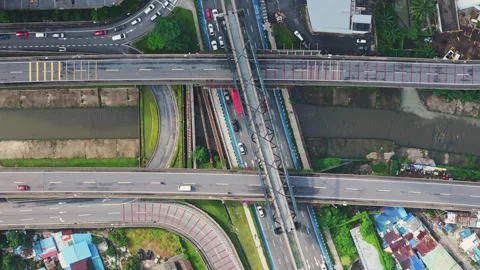 Aerial view of highway interchange and river canal in Kuala Lumpur city center Stock Footage 327120126