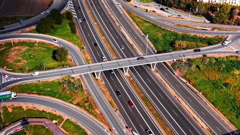 Aerial view of highway interchange and pedestrian bridge Stock Footage 330491344