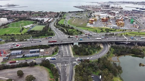 Aerial view of highway interchange and industrial port traffic Video stock 342326508