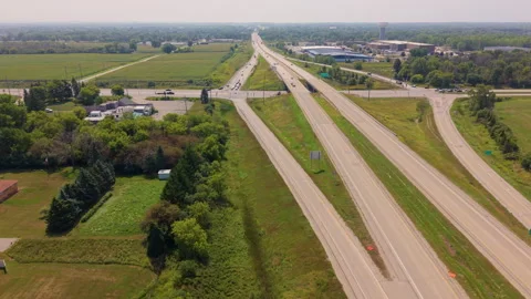 Aerial View Of Highway Interchange And Freeway Traffic In Rural Landscape Stock Footage 344099297