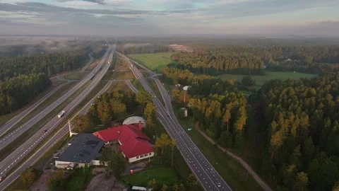 Aerial View of Highway Interchange and Rural Landscape at Golden Hour 스톡 동영상 344595658
