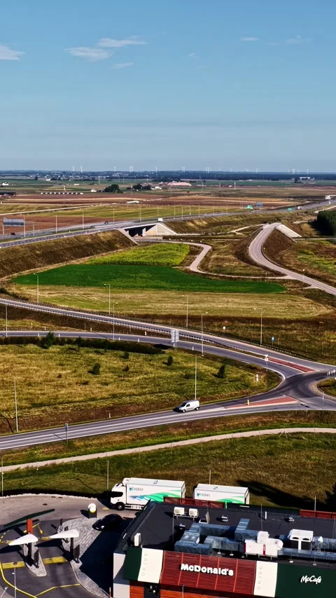 Aerial view of highway interchange and McDonalds restaurant near Suwalki Poland Stock Footage 345483470