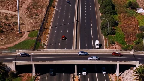 Aerial view of highway interchange with bridge and traffic Stock Footage 340404894