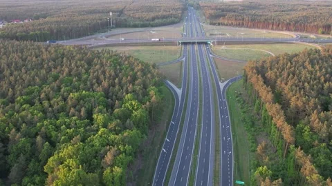 Aerial View of Highway Interchange in Forest at Sunset 스톡 동영상 311981649