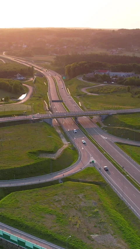 Aerial View of Highway Interchange at Golden Hour Sunset Stock Footage 337008029