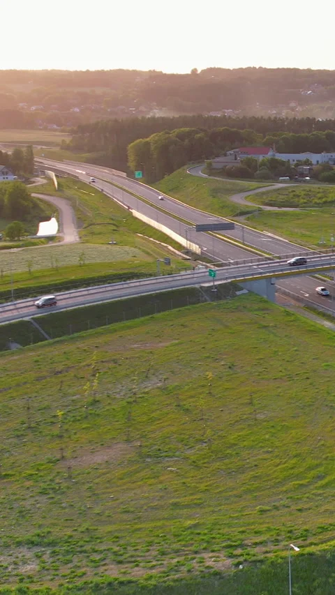Aerial View of Highway Interchange at Golden Hour Sunset Stock Footage 337113345