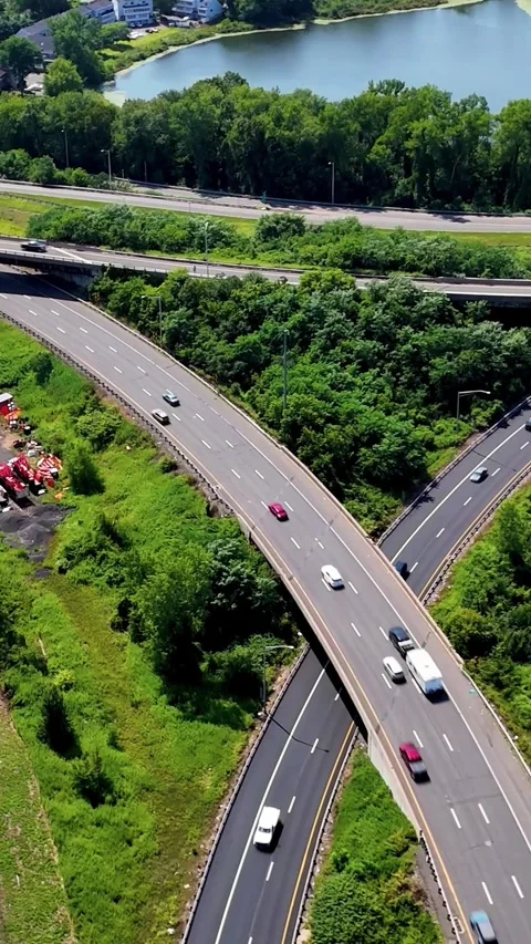 Aerial view of highway interchange with moving traffic... Stock Footage 344332547