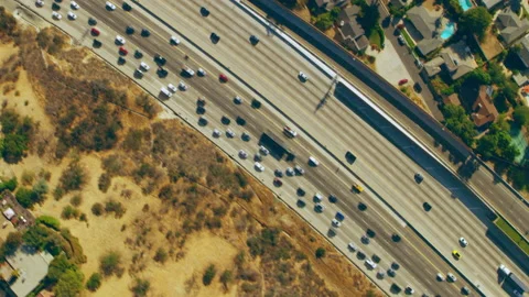 Aerial view of highway interchange on a sunny day in Los Angeles, California. Sh Stock Footage 199458317