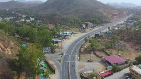 Aerial View of Highway Intersection in a Hilly Region of Rajasthan Stock Footage 310954648