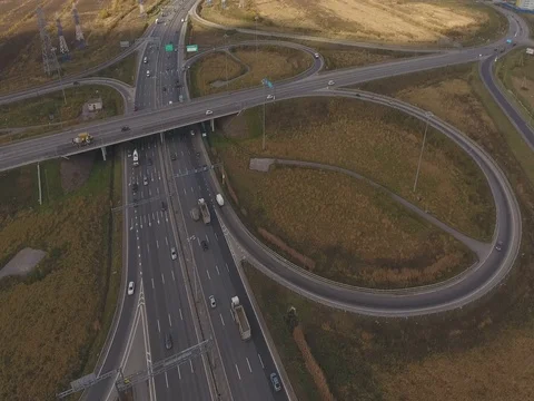 Aerial view of highway intersection with light traffic Stock Footage 82576200