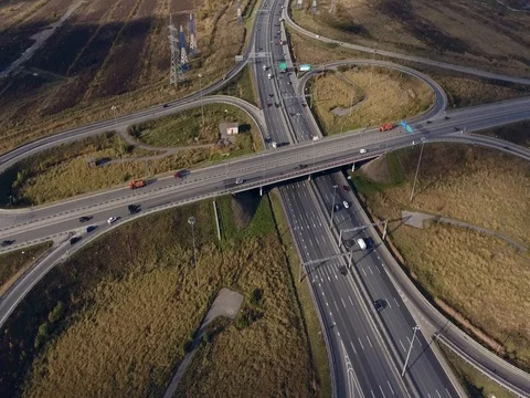 Aerial view of highway intersection with light traffic Stock Footage 82576210