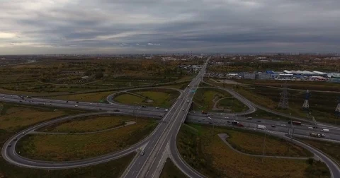 Aerial view of highway intersection with light traffic Stock Footage 84264292