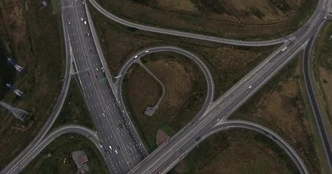 Aerial view of highway intersection with light traffic Stock Footage 84264353