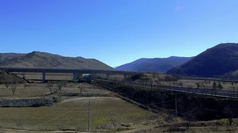 Aerial view of a highway intersection in the mountains of central Italy Stock Footage 125100384