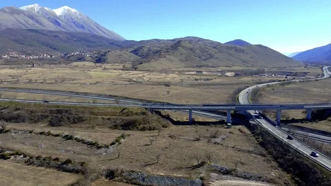 Aerial view of a highway intersection in the mountains of central Italy Stock Footage 125102351