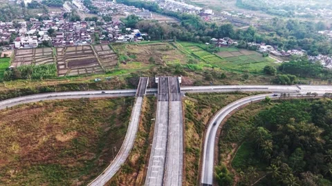 Aerial view of highway junction cutting through rural landscape Stock Footage 340604167