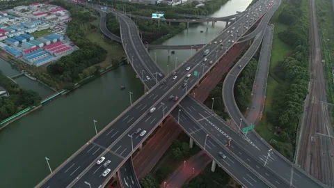 Aerial view of highway multi-level junction road with moving cars. Active Stock-Footage 152973539