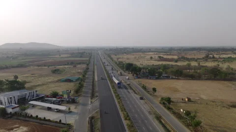 Aerial View of Highway Passing Through Rural Landscape in India Stock Footage 333813289