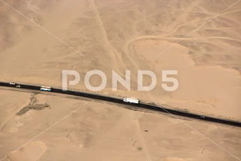 Aerial view of highway road in desert. Road trip travel adventure Stock Photos