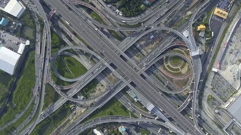 Aerial View of Highway Road Interchange with Busy Urban Traffic Speeding on Road Stock-Footage 84240646